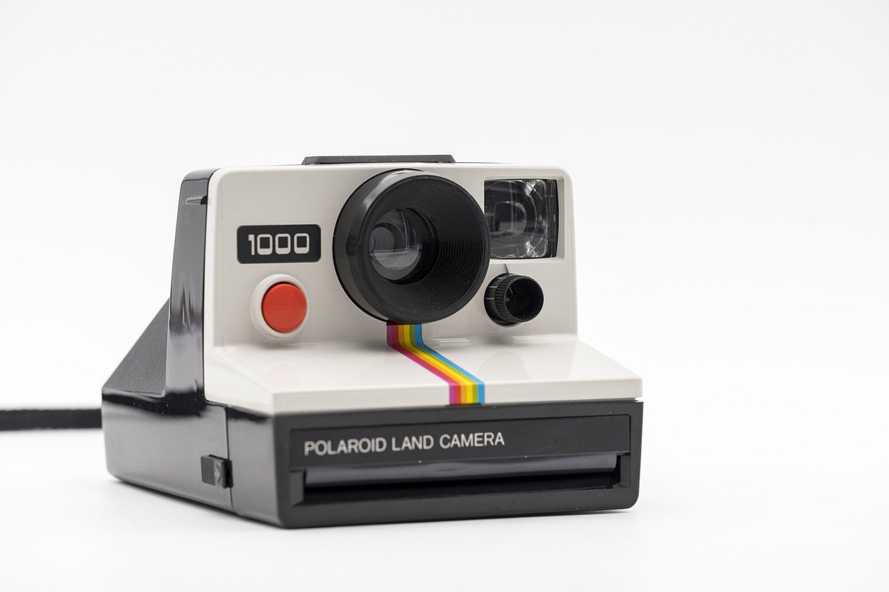 The Snap of a Polaroid Camera Freezes a Moment (image credits: pixabay)